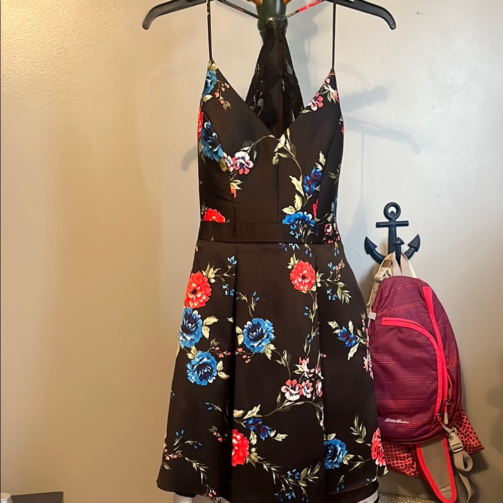 B. Smart Black Dress with Floral Accents